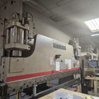 1990 Cincinnati 175AF X 10 Press Brake: 175-ton capacity, 10-foot bending length. Software upgrade completed in 2021 for enhanced control integration with current machining standards. Robust Cincinnati hydraulic system ensures precision and longevity in demanding metal forming applications. Has light curtain package. Note: No tooling or safety fencing included.